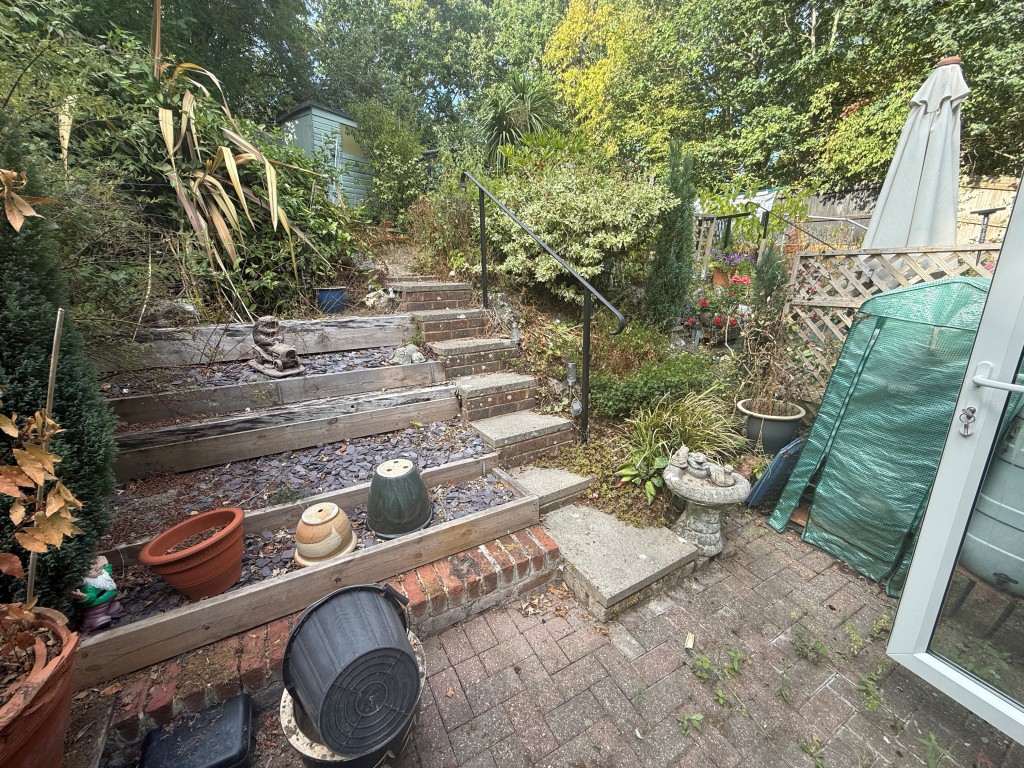Lot: 49 - TWO-BEDROOM HOUSE FOR INVESTMENT OR OCCUPATION WITH PARKING SPACE - Lower part of garden with paving